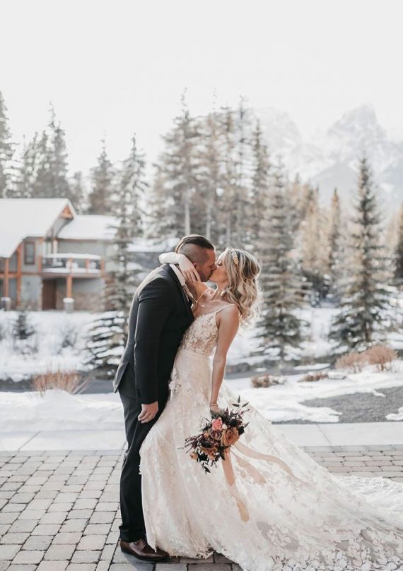 Dreamy winter wedding photos with snow background