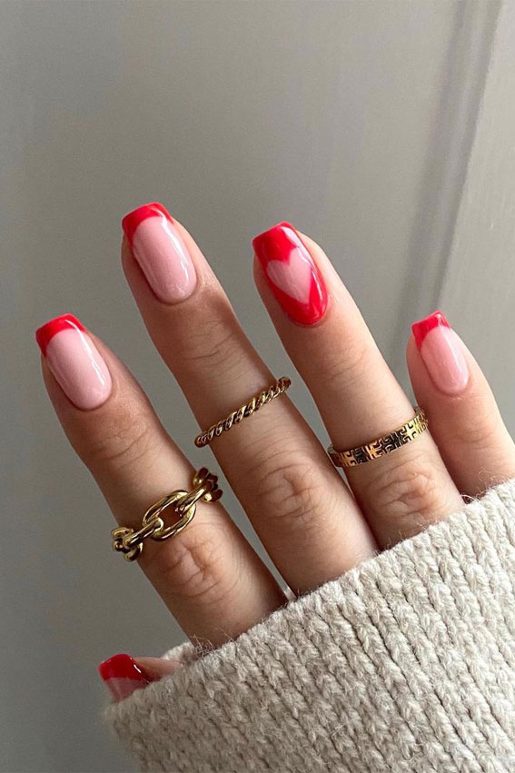 red french manicure with heart tips, red cut out heart nails, red valentines day nails, valentine nails 2022