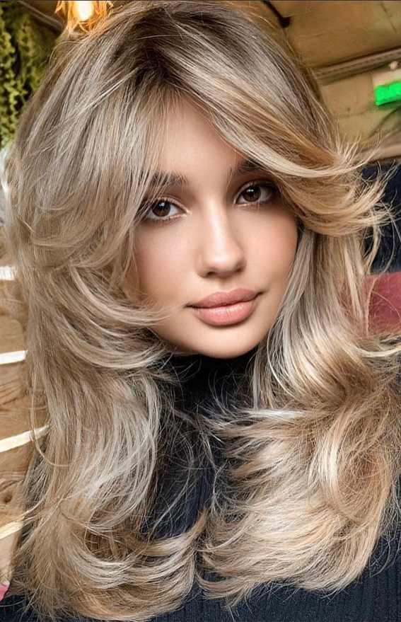 35 Best layered haircuts 2021 : Metallic Blonde Layered Haircut with Curtain Bangs